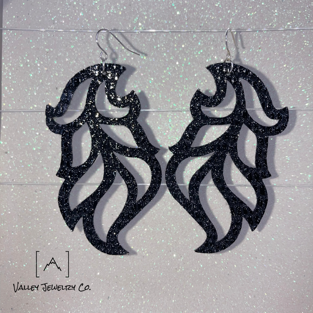 Elegant and simple design, these sculpted earrings are made of snake skin-style vegan leather, with silver fixtures. Pair them with any ensemble for extra style.

Todd, Todd Mertz, Mertz, Todd Adam Mertz