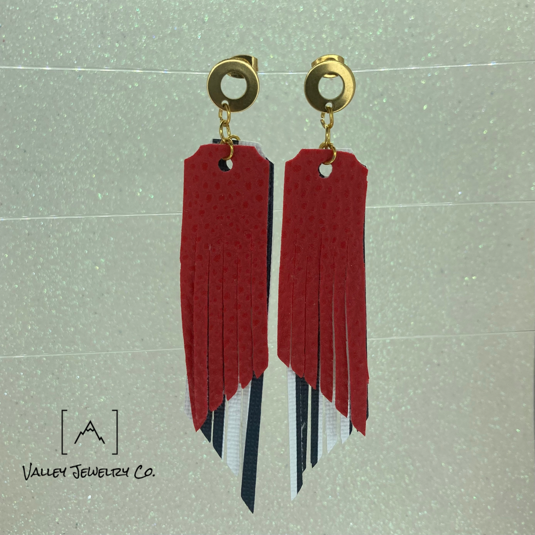 These Black and White Striped Tassel Earrings, have a layer of Red pebbled Vegan Leather stacked on top. Perfect for the girl who loves to be different and stand out from the crowd. They are a statement earring, that adds a little edge to any look.  Available in limited quantities.  Total Length: 4 Inches  Drop Length: 3.5 Inches

Todd, Todd Mertz, Mertz, Todd Adam Mertz